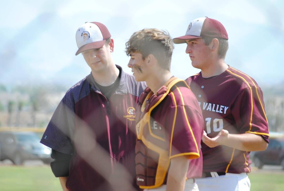 Drew Middleton and former Trojans Jake Riding and Coby Tillery share a moment on the field back ...