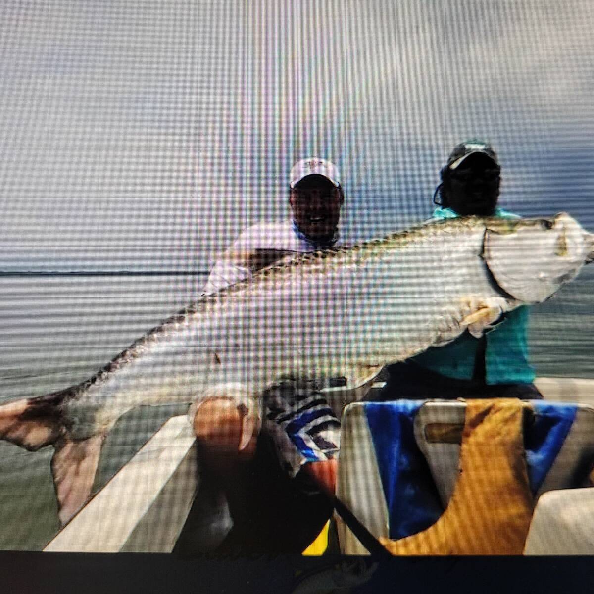 Friend Carlos left Alaskan snowstorms for a fishing adventure in warmer climes and poses with o ...