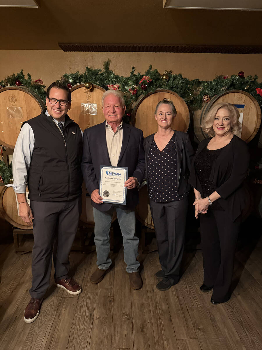 Local winemakers Tim Burke and Pam Tyler of Artesian Cellars were presented with a certificate ...