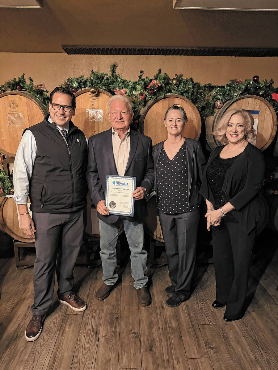 Local winemakers Tim Burke and Pam Tyler of Artesian Cellars were presented with a certificate ...