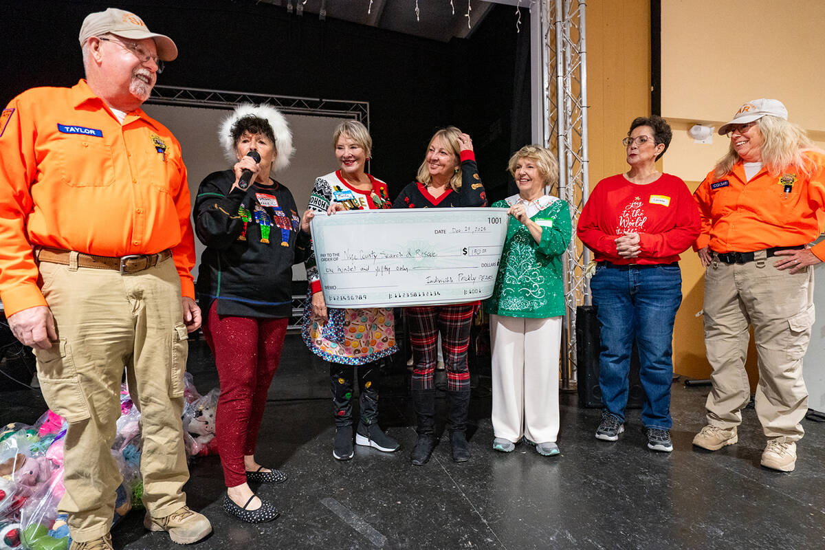 At the Community Christmas Eve Dinner, the Nye County Indivisible Prickly Pears presented South ...