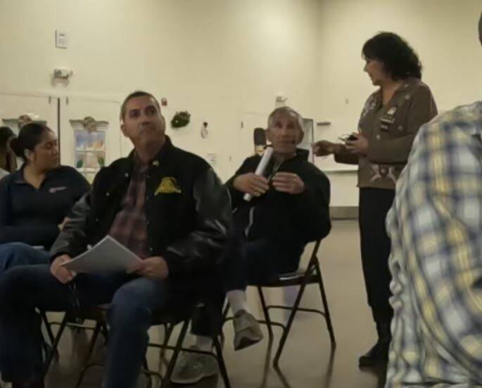 Board meeting attendee Ed Ringle discusses status of the Amargosa River with presenter Mason Vo ...