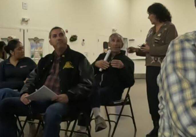 Board meeting attendee Ed Ringle discusses status of the Amargosa River with presenter Mason Vo ...