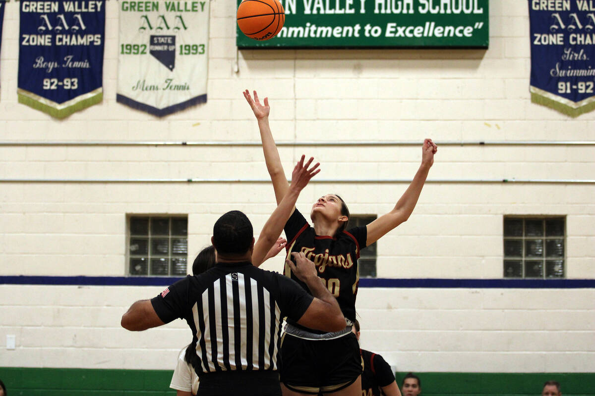Pahrump Valley High School junior Riley Saldana wins the opening tip off in the Trojans tournam ...