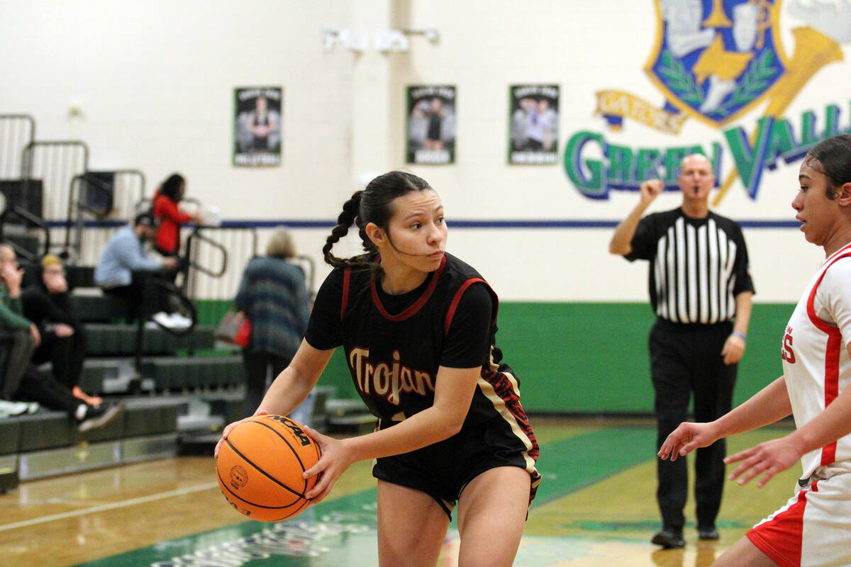 Pahrump Valley High School junior guard Autumn Colon tries to escape the corner during the Lady ...