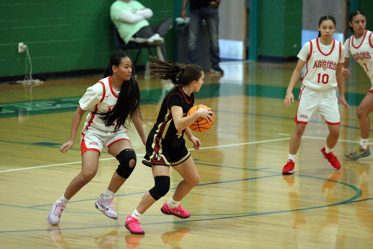 Pahrump Valley High School sophomore guard Aurora Bowers protects the ball against Arbor View d ...