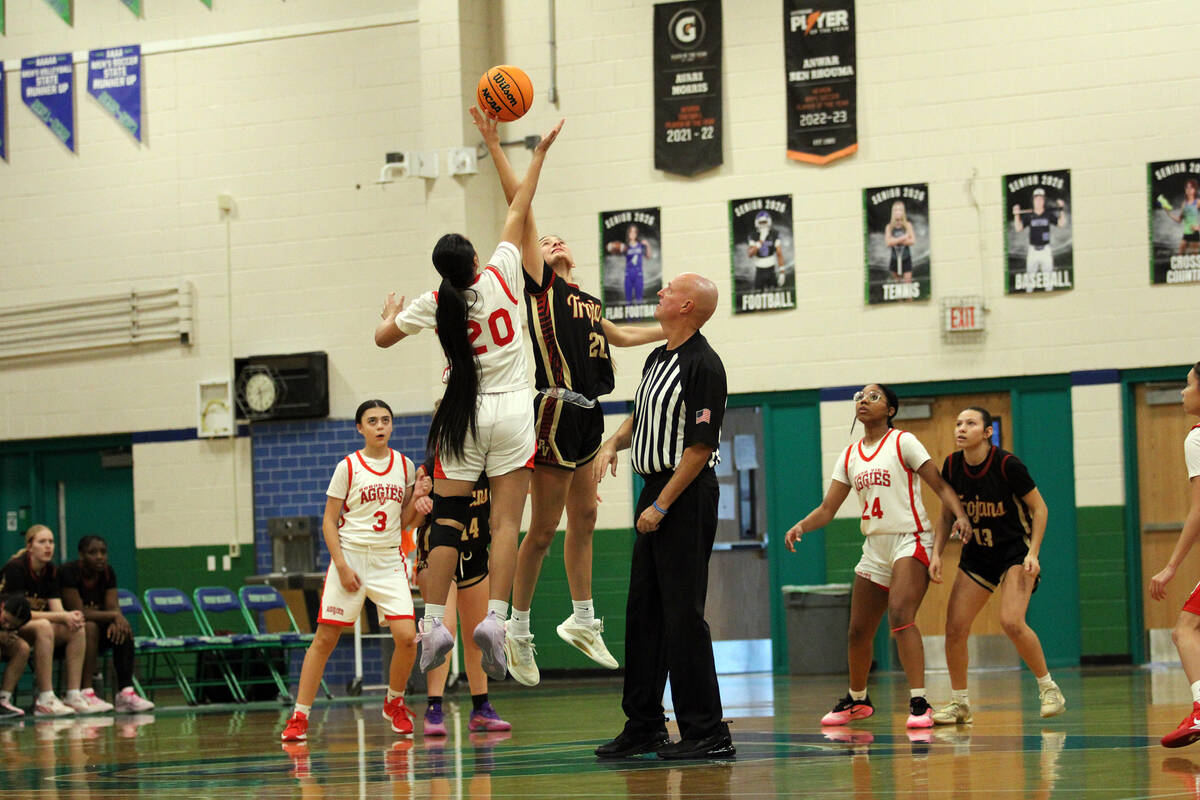Pahrump Valley High School junior Riley Saldana wins the opening tip off against Arbor View jun ...