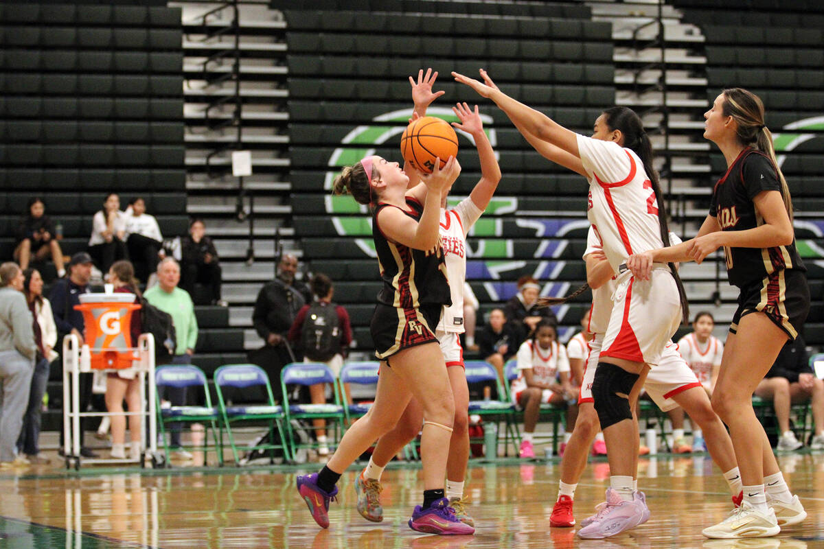 Pahrump Valley High School guard Sydney Crotty is met with double-team pressure as the junior l ...
