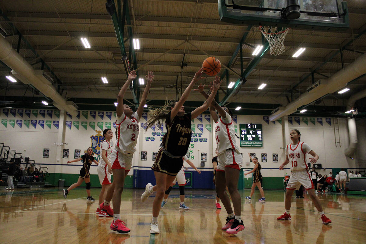 Pahrump Valley High School junior captain Riley Saldana fights for control of the ball against ...