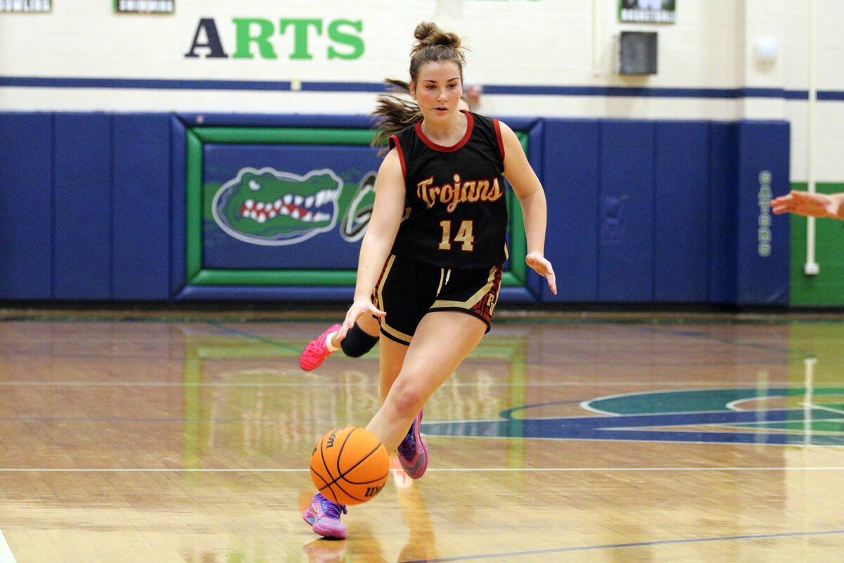 Pahrump Valley High School junior guard Sydney Crotty dribbles the ball past midcourt during th ...
