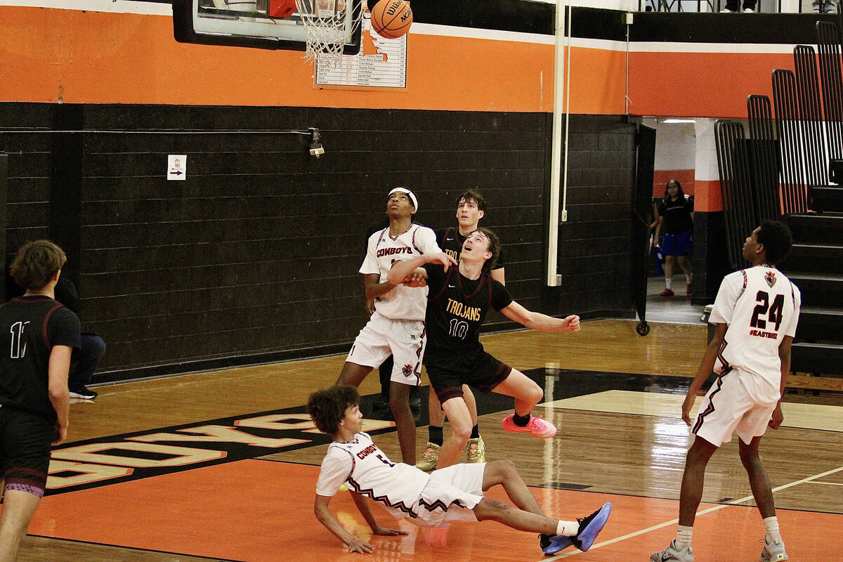 Pahrump Valley High School junior Lucas Gavenda attempts to box out Chaparral sophomore guard D ...