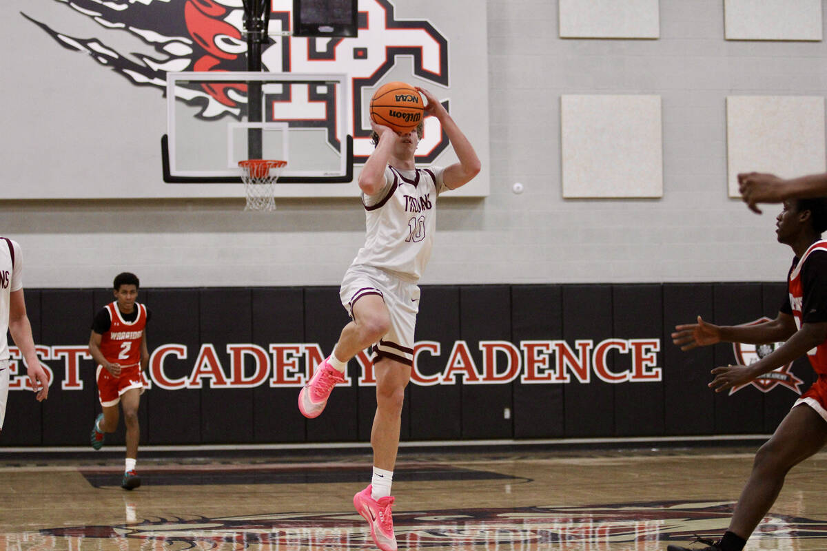 Pahrump Valley High School junior forward Lucas Gavenda tries to release a half-court shot at t ...