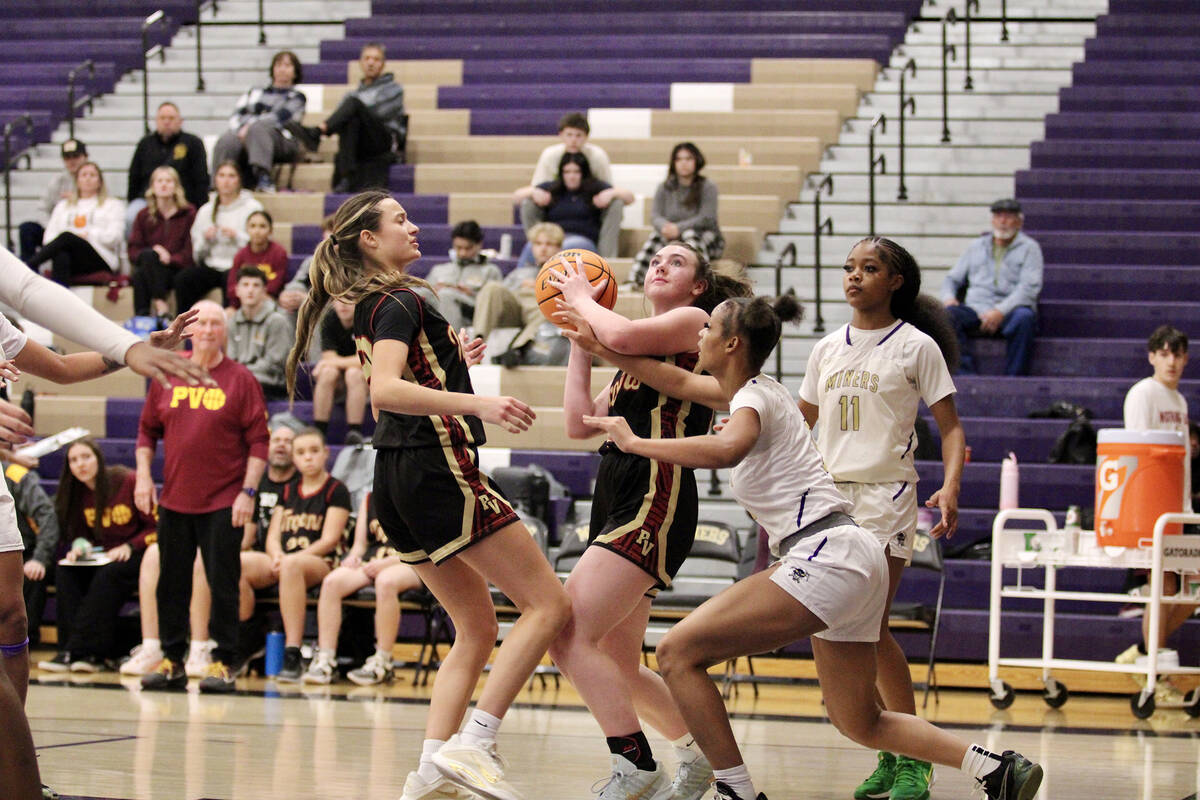 Pahrump Valley High School sophomore guard Kaitlyn Brown looks for the best opportunity to get ...