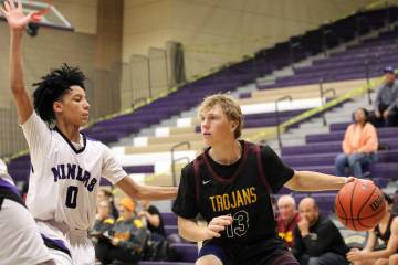 Pahrump Valley High School junior TC Hone looks to find an open man against Sunrise Mountain's ...