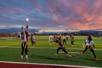 The Trojans flag football team attempts to stop a Clark High School touchdown from coming throu ...