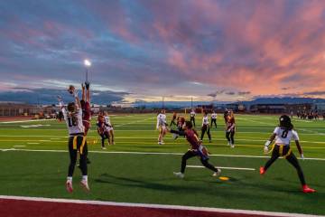 The Trojans flag football team attempts to stop a Clark High School touchdown from coming throu ...