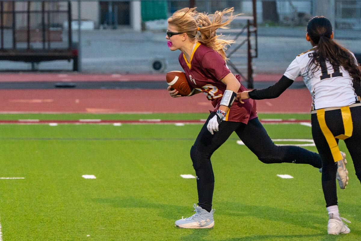 Pahrump Valley High School senior quarterback/wideout Savannah Thompson tries to break away fro ...
