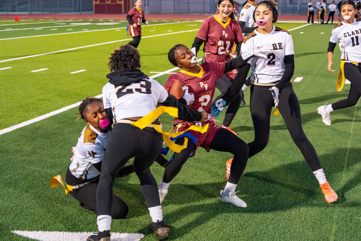 Pahrump Valley High School flag football freshman wideout Ma'liyah Collins tries to evade multi ...