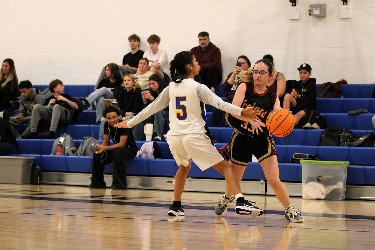 Pahrump Valley High School girls basketball junior Kaylan Robinson gets past Cristo Rey St. Via ...