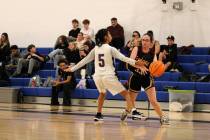 Pahrump Valley High School girls basketball junior Kaylan Robinson gets past Cristo Rey St. Via ...
