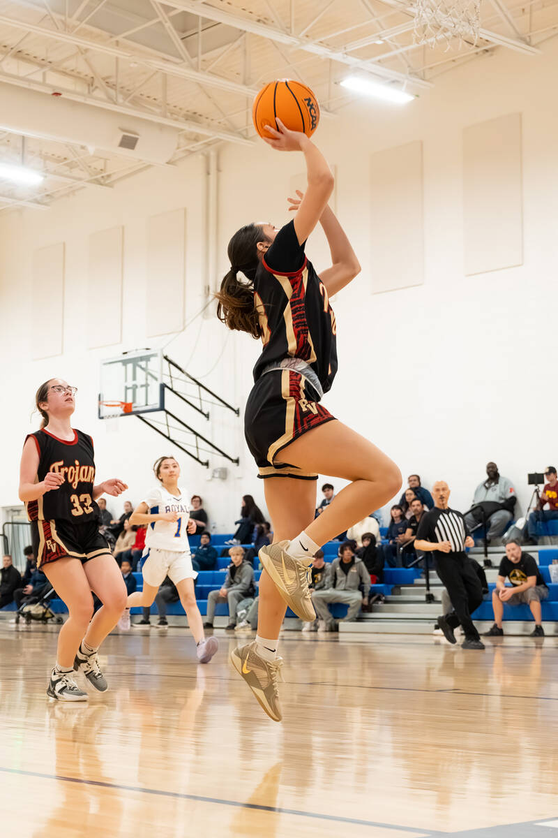 Pahrump Valley High School junior Autumn Colon goes up for the layup attempt during the Trojans ...