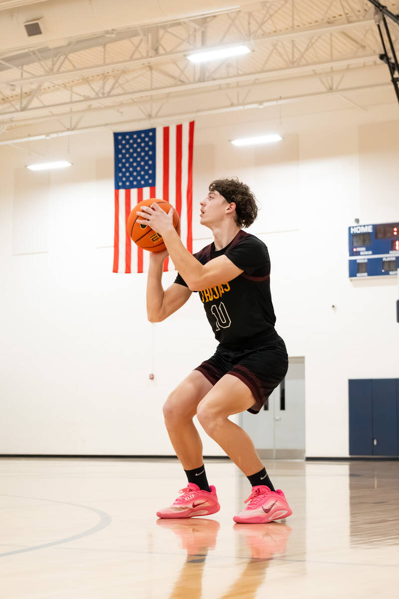 Pahrump Valley High School junior Lucas Gavenda attempts to pull up from beyond the arch agains ...