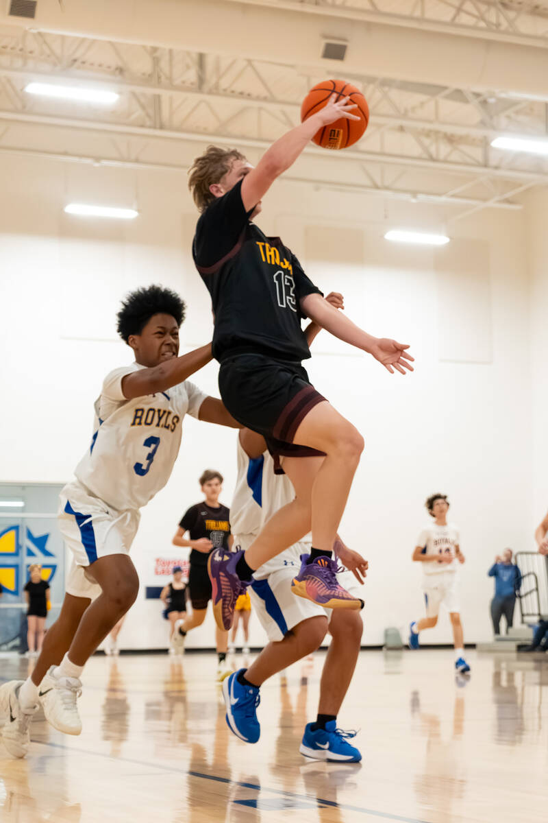 Pahrump Valley High School junior TC Hone goes in for an uncontested layup attempt against Cris ...