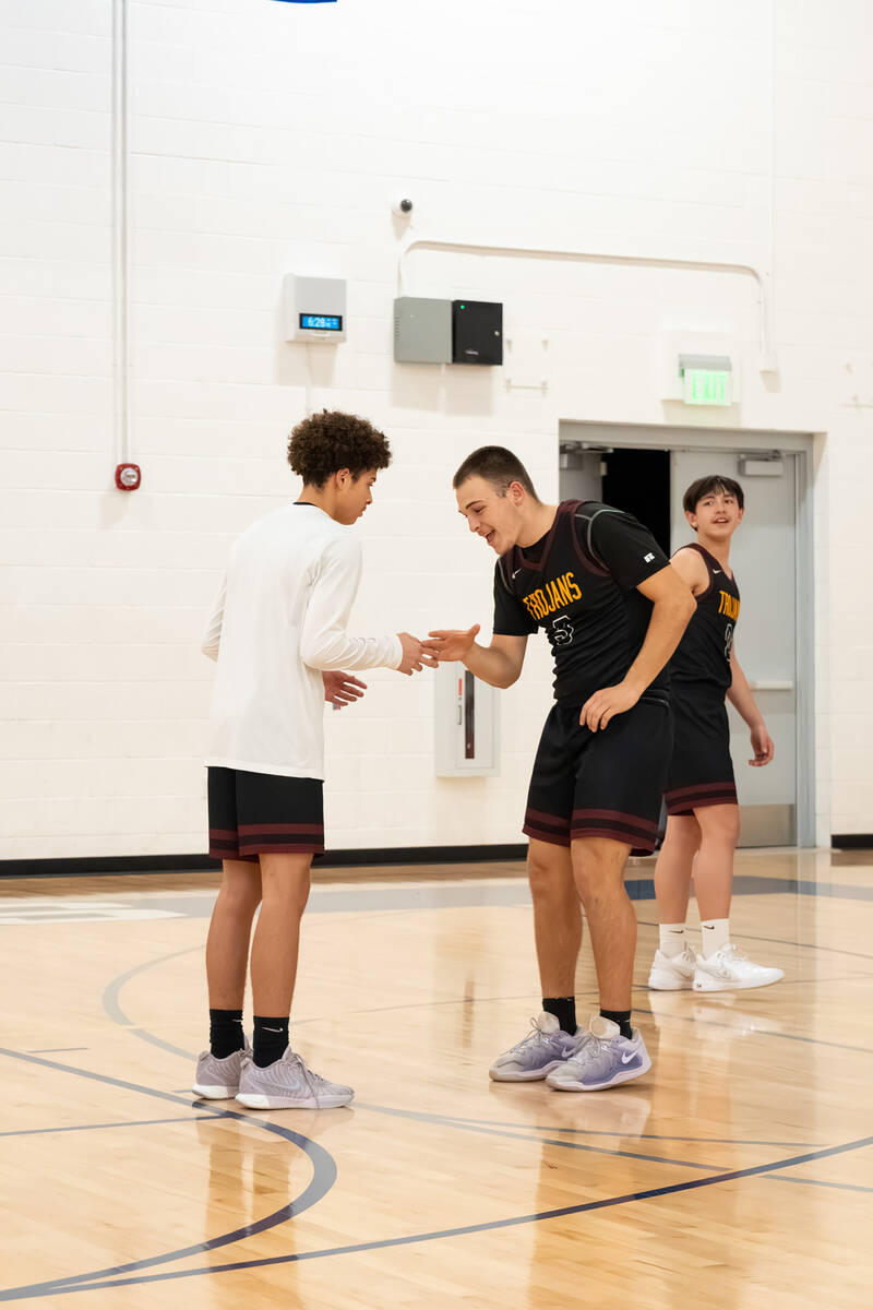 Pahrump Valley High School's Trae plein (left) and Joshua Slusher (right) share an intricate ha ...