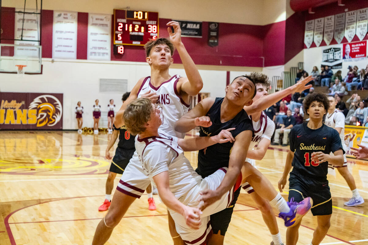 PVHS's TC Hone and Aydon Veloz get entangled between a SECTA defender during the Trojans home g ...