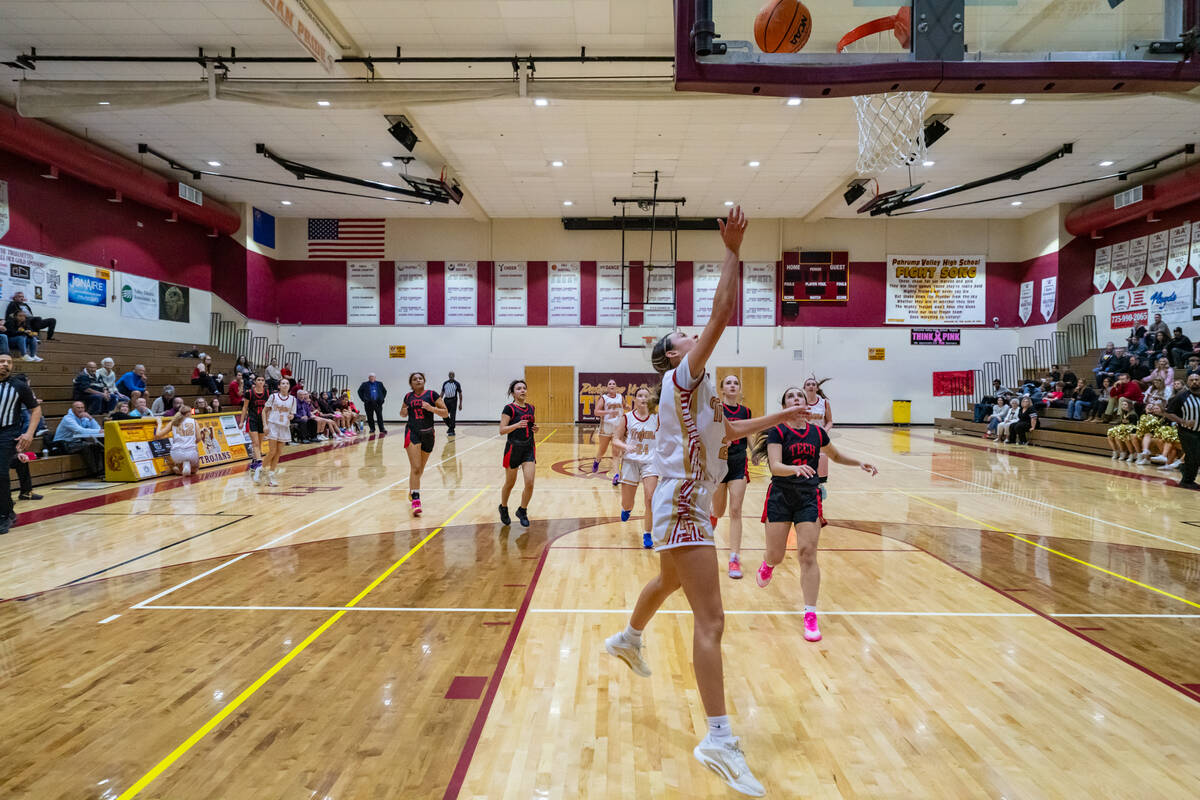Pahrump Valley High School junior Riley Saldana successfully converts a layup attempt against S ...
