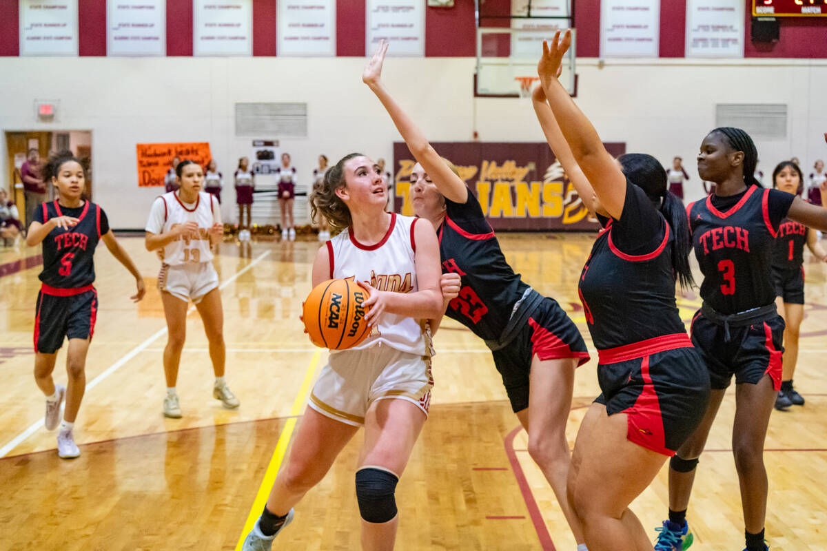 Pahrump Valley High School sophomore Kaitlyn Brown comes in hard into double coverage during a ...