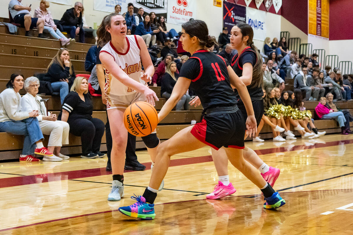 Pahrump Valley High School sophomore Kaitlyn Brown swings the ball past SECTA defender Liyah El ...