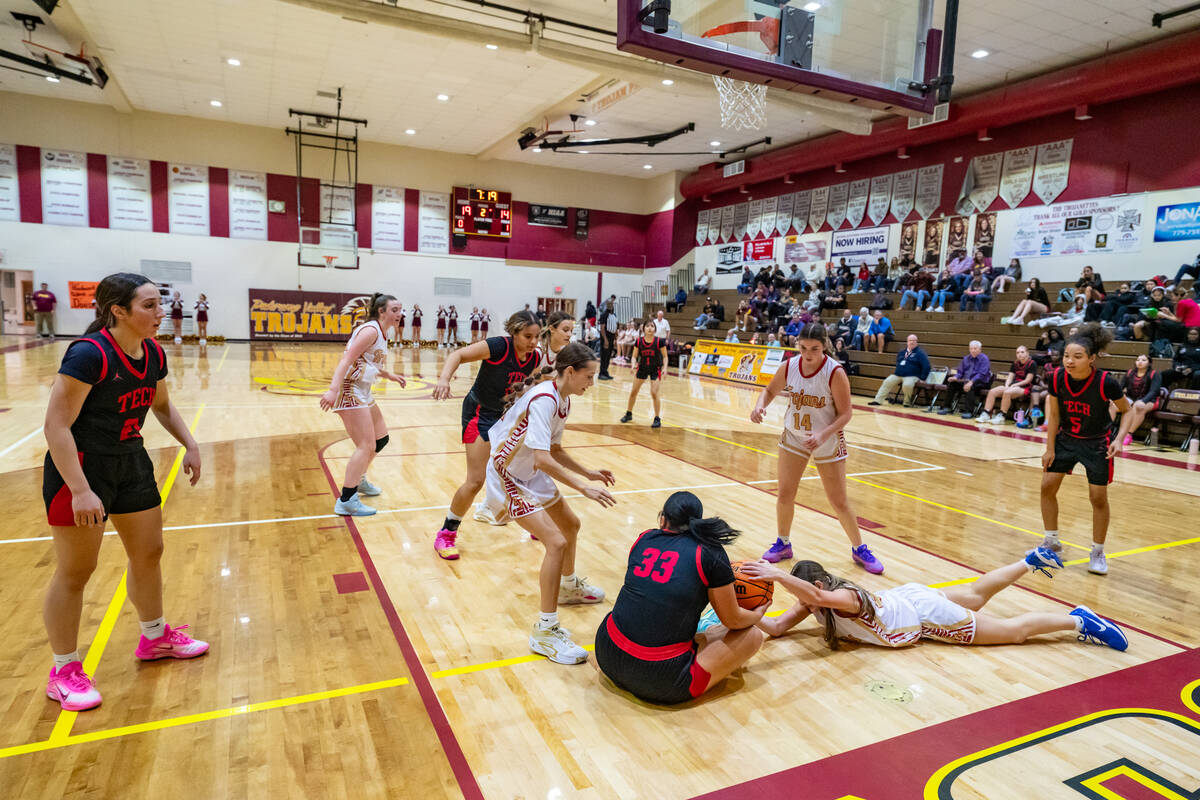 Pahrump Valley High School sophomore Ella Odegard fights for possession of the ball against SEC ...