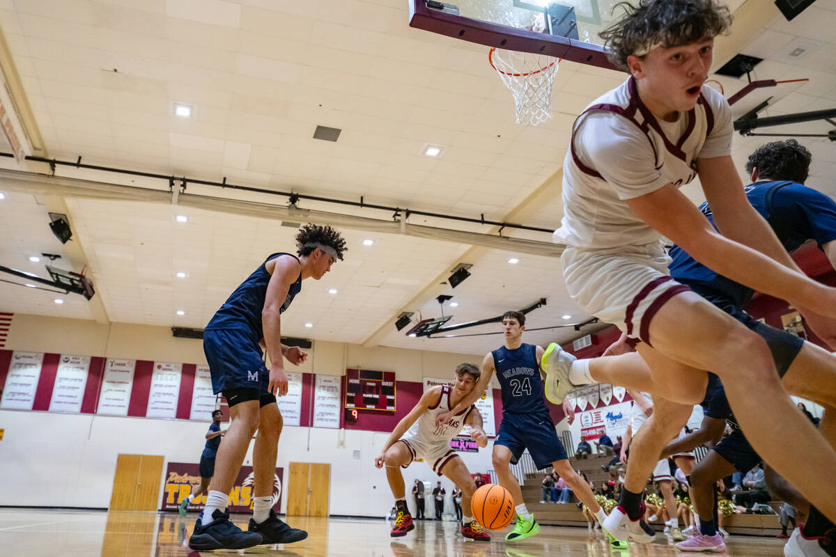 Pahrump Valley High School junior Lucas Gavenda saves possession of the ball during the Trojans ...