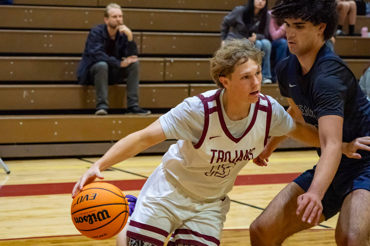 Pahrump Valley High School junior TC Hone does everything he can to evade a Mustangs defender i ...