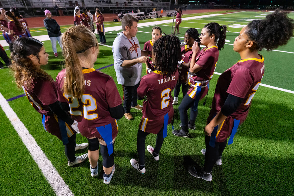 Pahrump Valley High School flag football assistant coach Edward Rankin huddles the team togethe ...