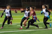 Pahrump Valley High School junior linebacker Ember Castaneda-Dabney attempts to pull a flag fro ...