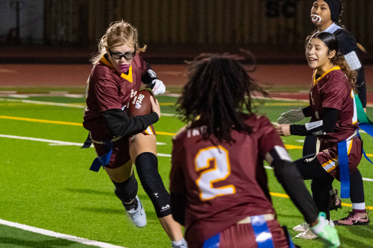 Pahrump Valley High School senior quarterback Savanna Thompson takes off with the ball off the ...