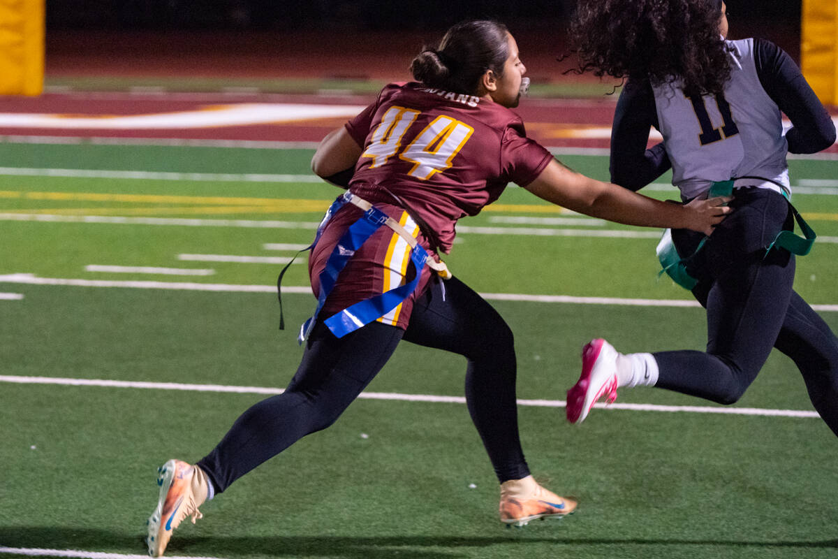 Pahrump Valley High School junior linebacker Jazmyn Herrera gives her best effort to get a hand ...