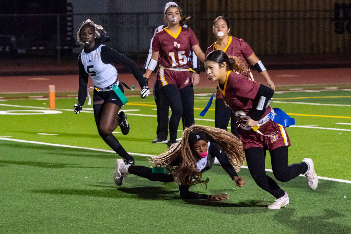 Pahrump Valley High School senior DB/S Anjolina Mercado evades a defender during the Trojans' h ...
