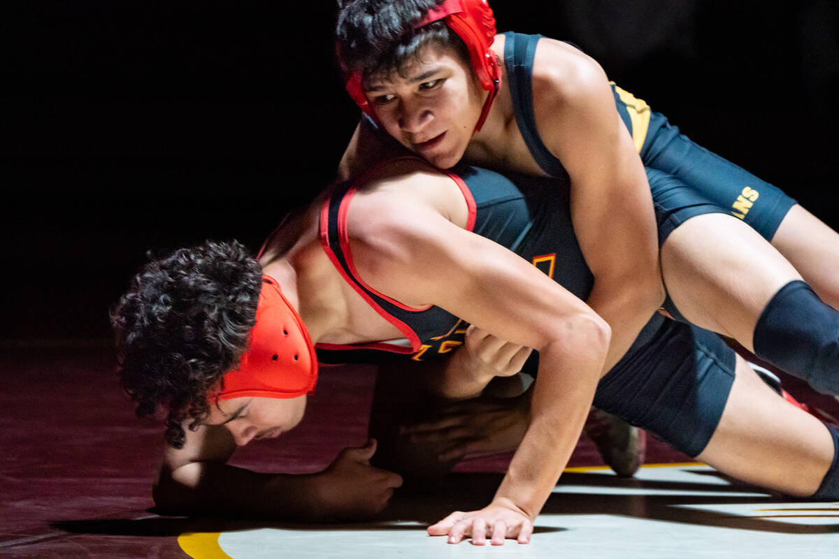 Pahrump Valley High School senior Benjamin De Santiago gets good top position against his oppon ...