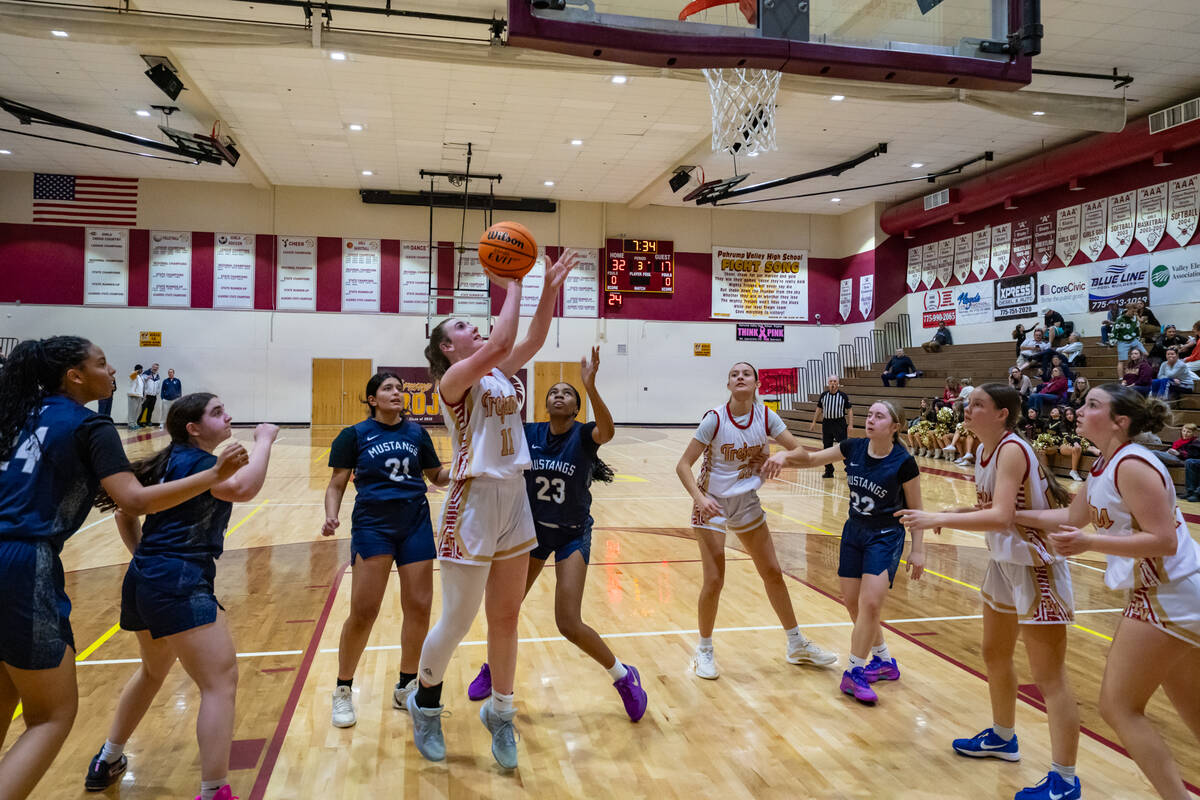 Pahrump Valley High School varsity girls basketball sophomore Kaitlyn Brown attempts to finish ...