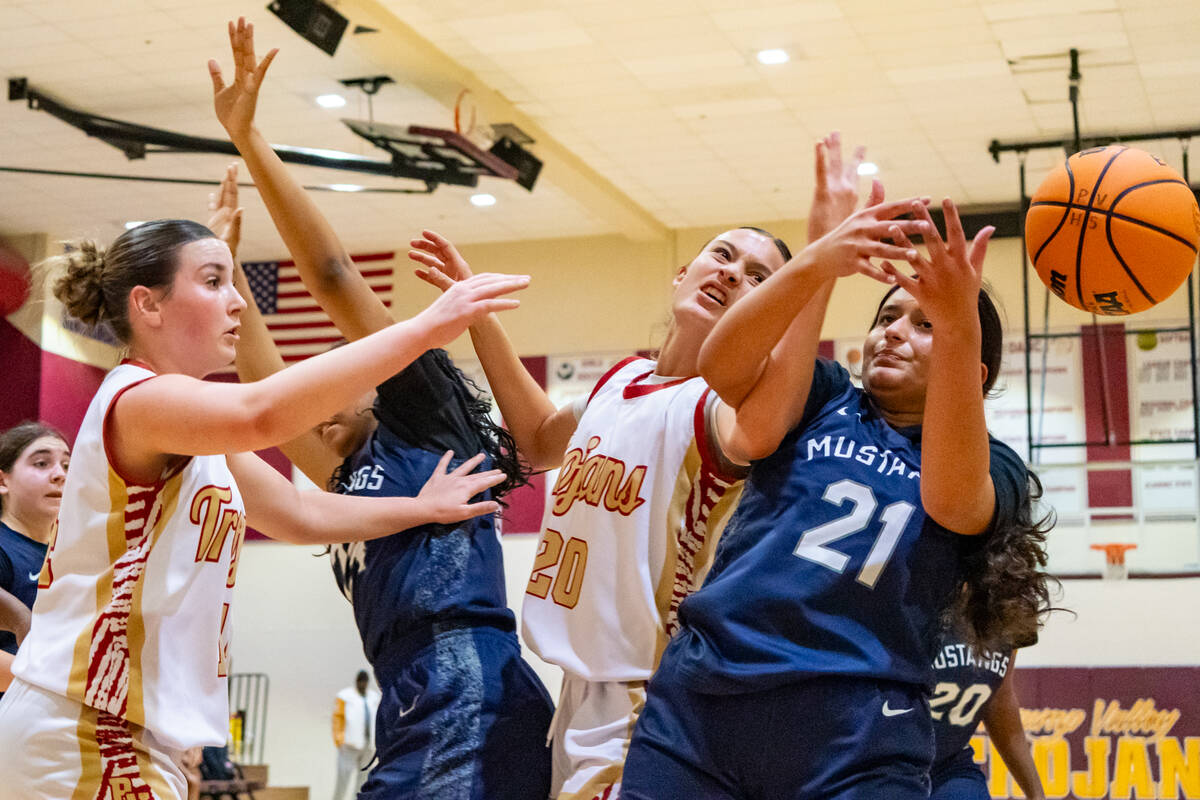 Pahrump Valley High School varsity girls basketball junior Riley Saldana has the ball knocked a ...