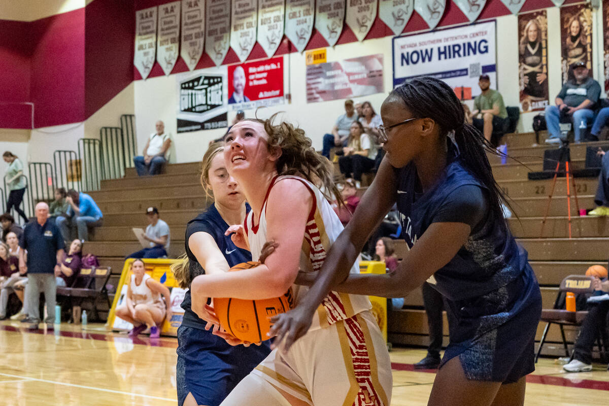 Pahrump Valley High School varsity girls basketball sophomore Kaitlyn Brown does her best to ev ...