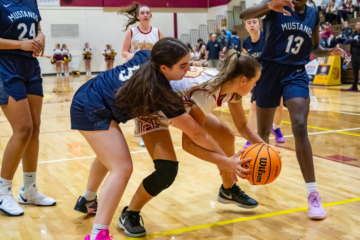 Pahrump Valley High School varsity girls basketball sophomore Cindal Monahan fights for control ...