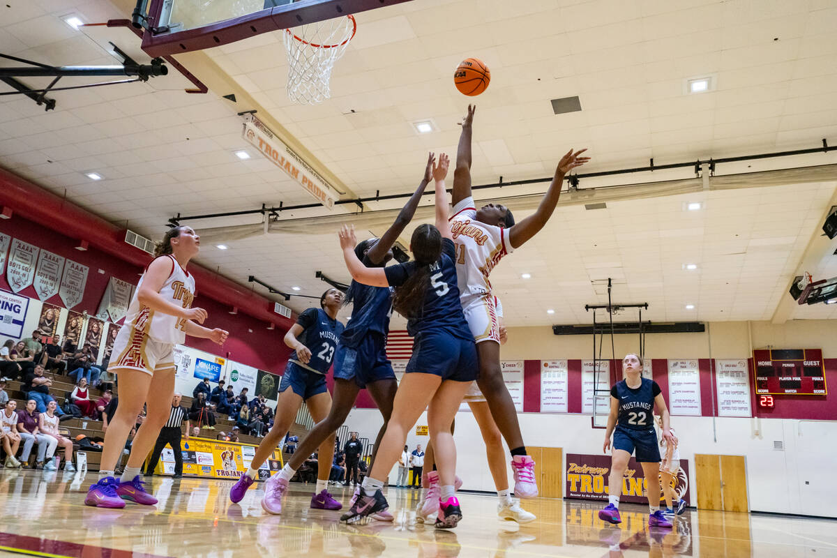 Pahrump Valley High School varsity girls basketball sophomore Adrian Rogers converts on a layup ...
