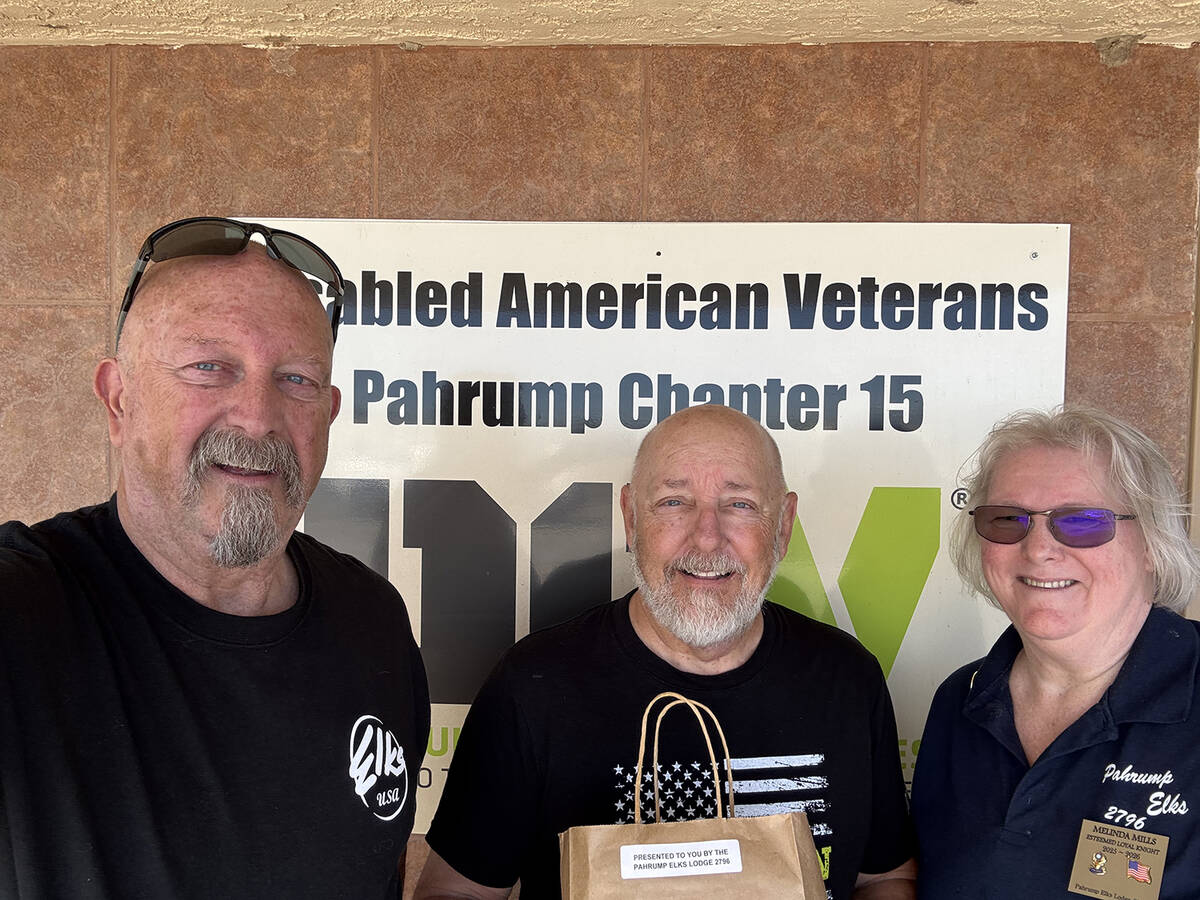 Pahrump Elks Exalted Ruler Pete Kurylowicz, left, and Elks Loyal Knight Melinda Mills, right, p ...
