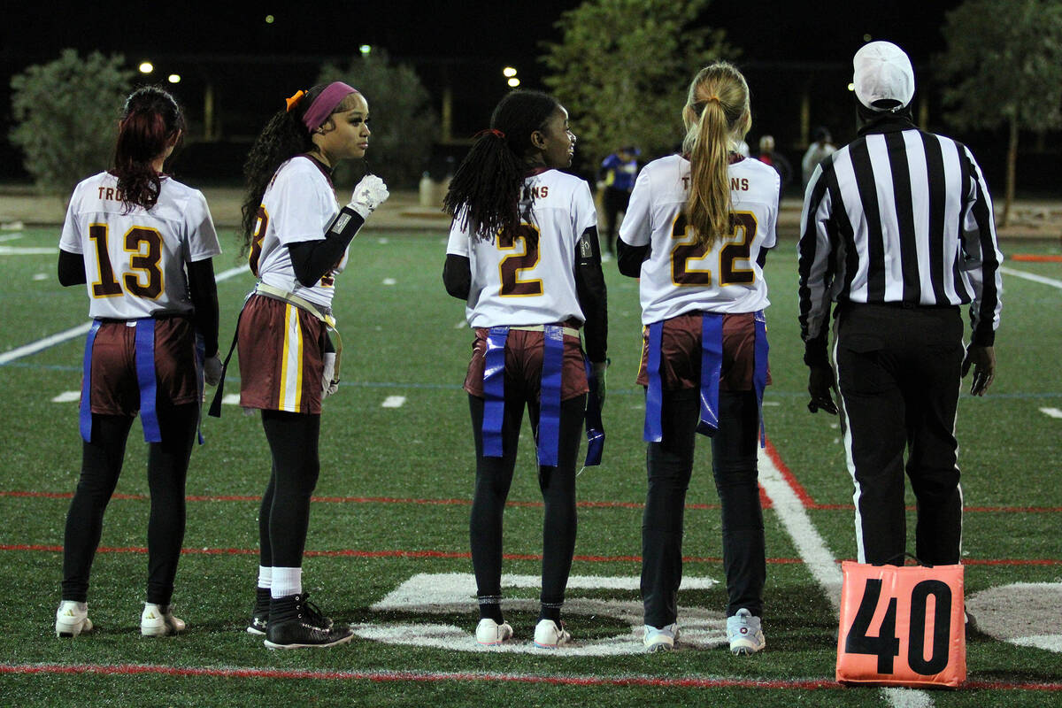 Pahrump Valley High School flag football captains Anjolina Mercado (left), A'shyra Fisher (midd ...