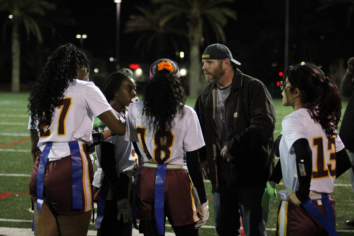 Pahrump Valley High School flag football head coach Jeff Corbett talks to the offensive unit du ...