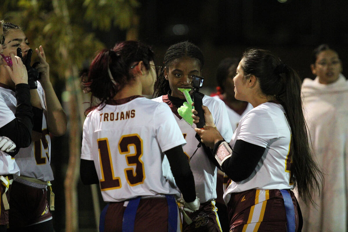Pahrump Valley High School flag football teammates Jazmyn Herrera (right), Diona Nixon (middle) ...